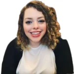 Alice Gant, a woman with curly hair, smiles at the camera; she is an ILS Case Manager in Bishop's Stortford, Essex.