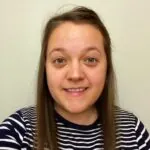 Michelle Marshall, an ILS Case Manager from Ipswich, Suffolk, has long hair and is wearing a striped shirt.