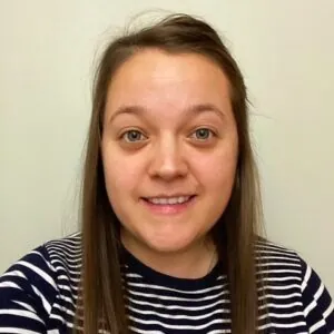 Michelle Marshall, an ILS Case Manager from Ipswich, Suffolk, has long hair and is wearing a striped shirt.