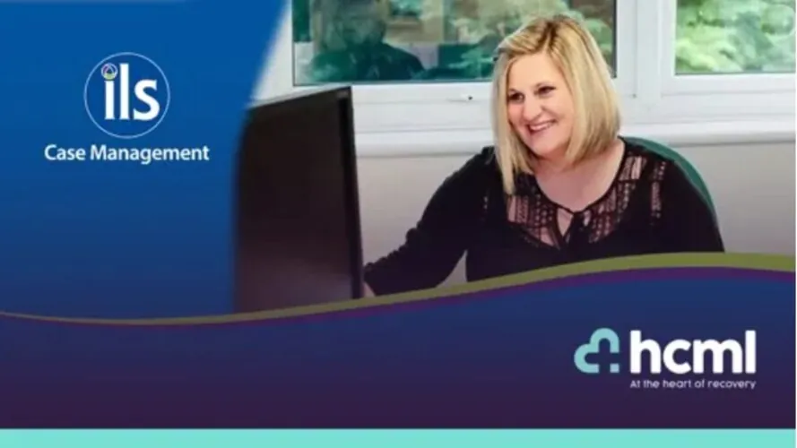 HCML Acquisition of ILS Case Management. Blond lady at desk smiling.